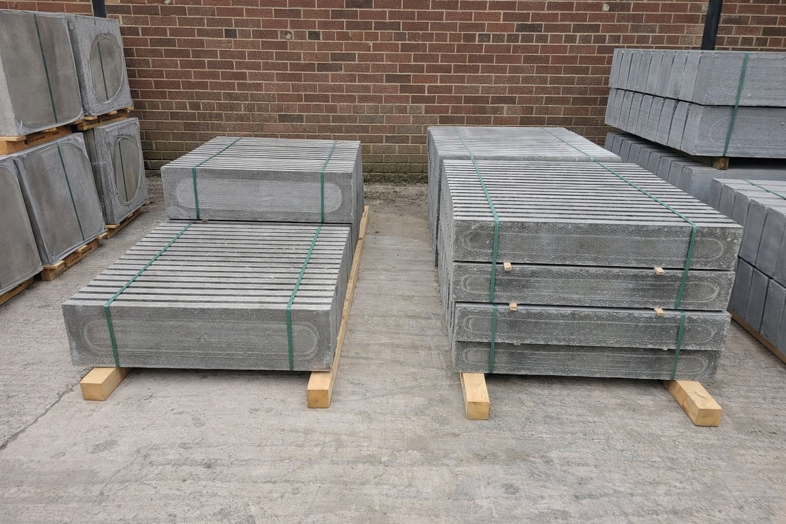 Stacks of concrete posts and gravel boards in the stock yard